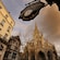A cathedral flanked by buildings